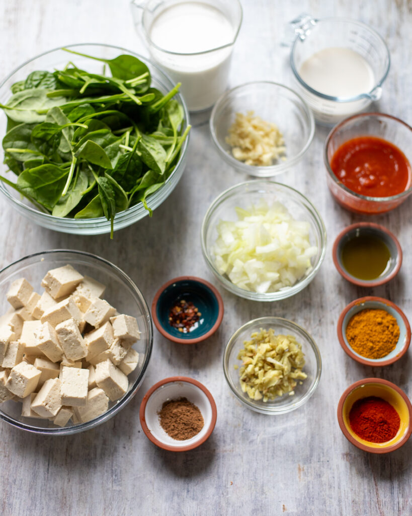 ingredients for saag tofu in small bowls