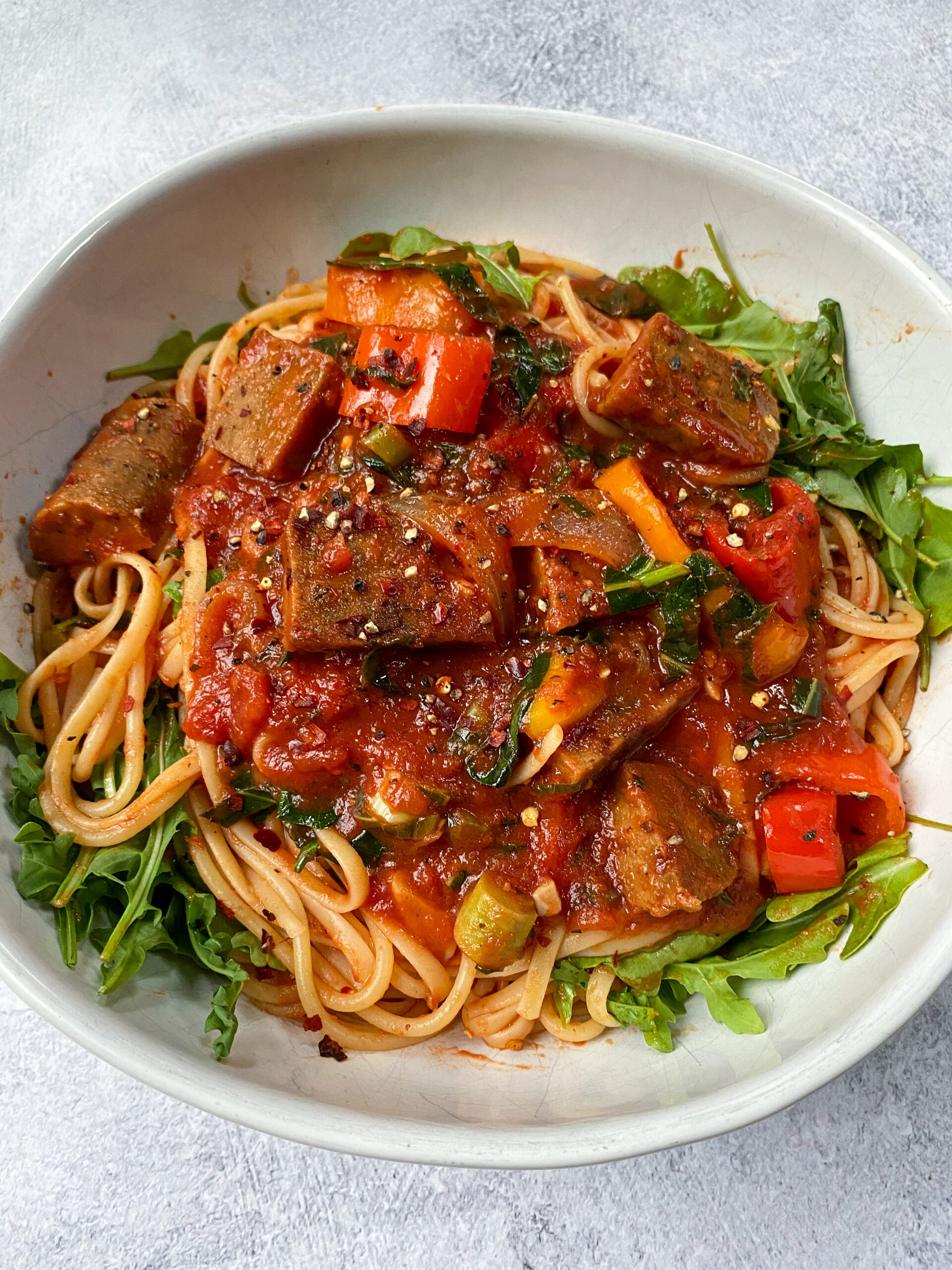 https://betterfoodguru.com/wp-content/uploads/2021/03/hearty-sausage-and-peppers-pasta-scaled.jpg