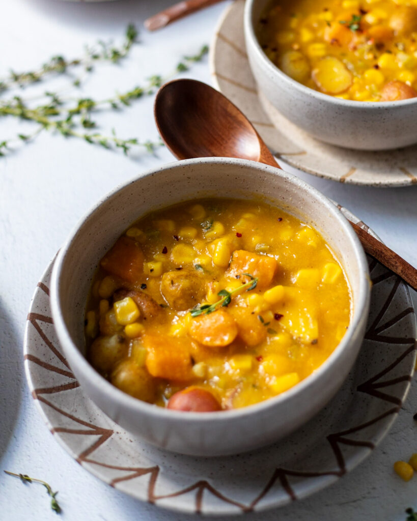 Bowl of Vegan Corn Chowder with sweet potatoes and butternut squash