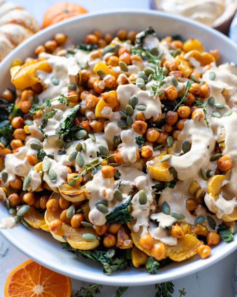 overhead view of roasted delicata squash salad with maple tahini