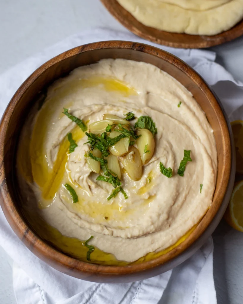 overhead view of a bowl of white bean and garlic dip