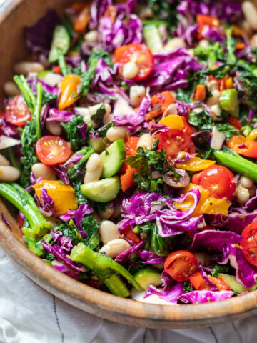 image closeup of broccoli rabe and white bean salad