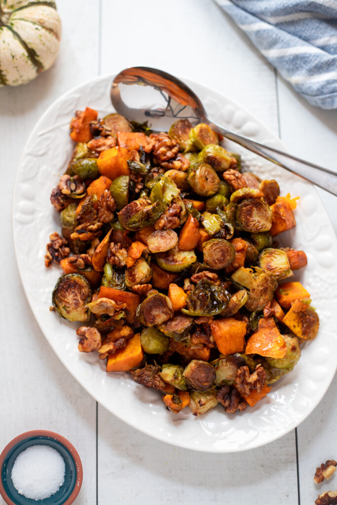 overhead view of a platter filled with roasted brussels sprouts and squash