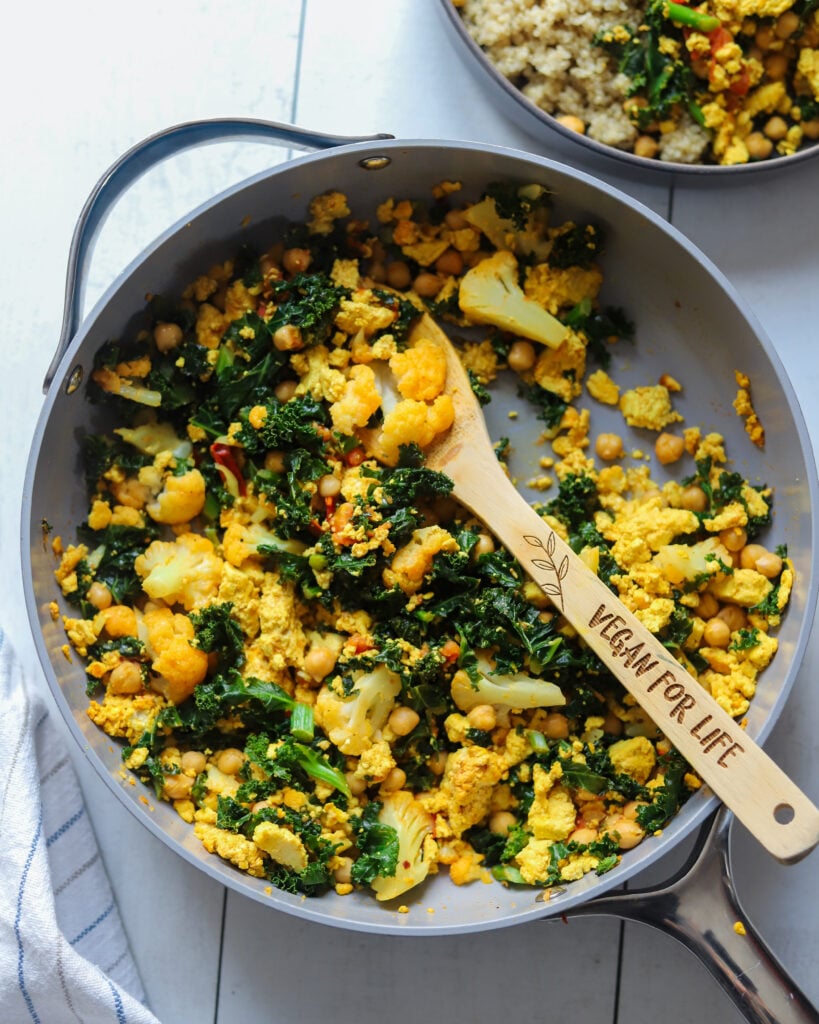 pan full of tofu scramble with chickpeas and kale