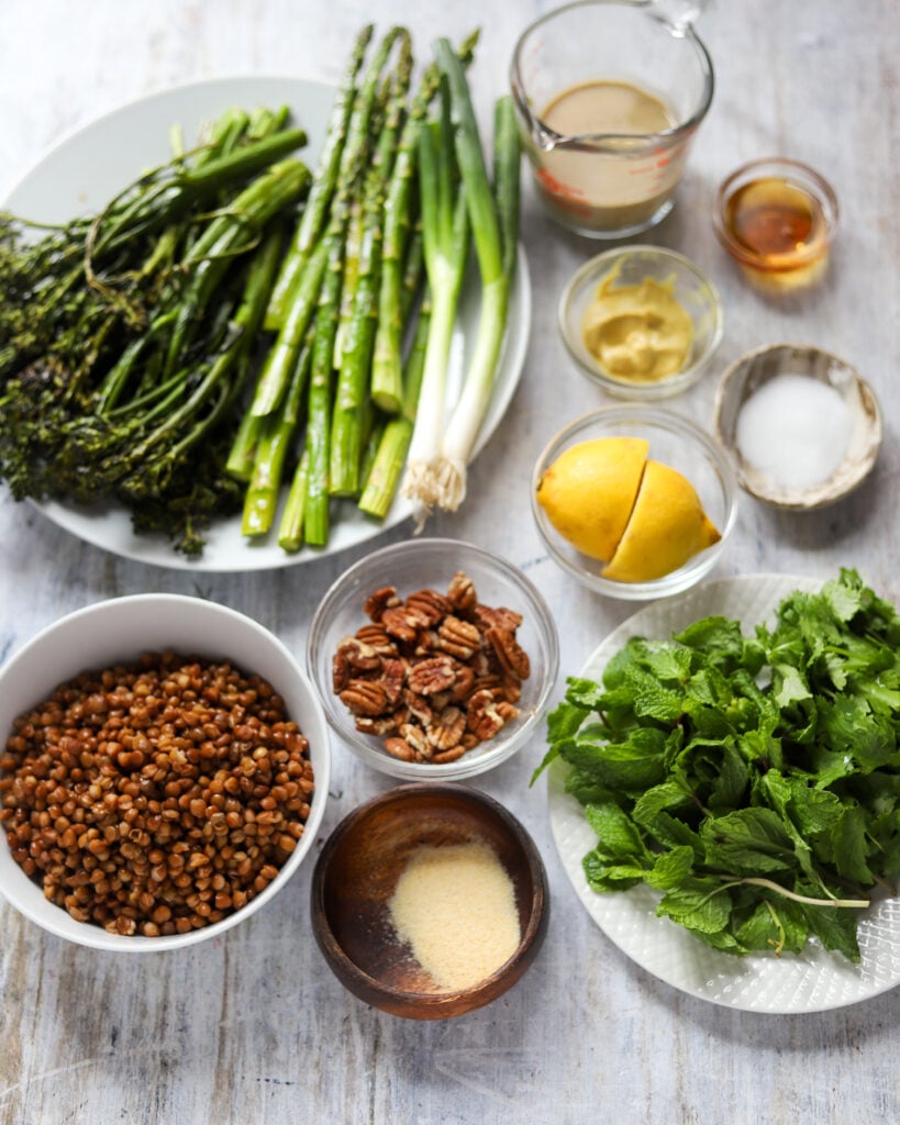 ingredients for the salad in small bowls laid out in flatlay