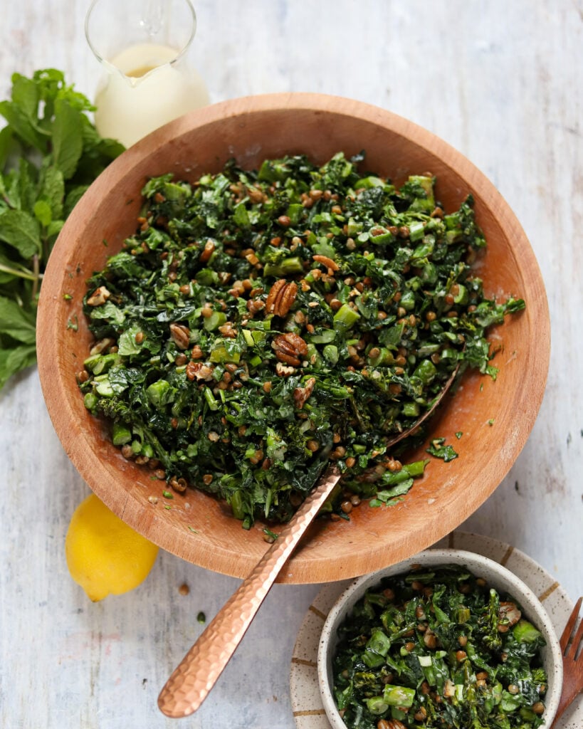 wide angle view of chopped salad with asparagus and broccolini, lentils and pecans