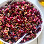 overhead view of a colorful salad with beets, radishes, lentils and herbs