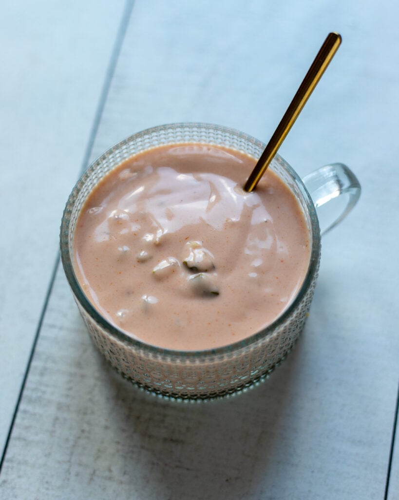 small jar with thousand island dressing and a little spoon