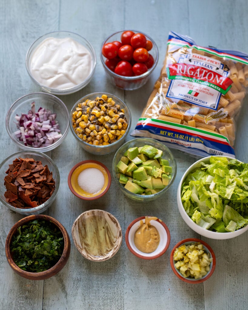Flatly of the ingredients for Vegan BLT Pasta Salad in bowls