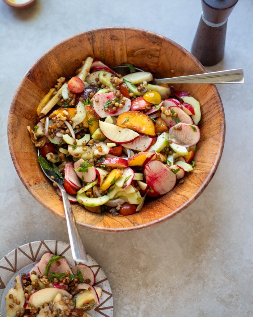 wide angle view of summer peach salad with lentils
