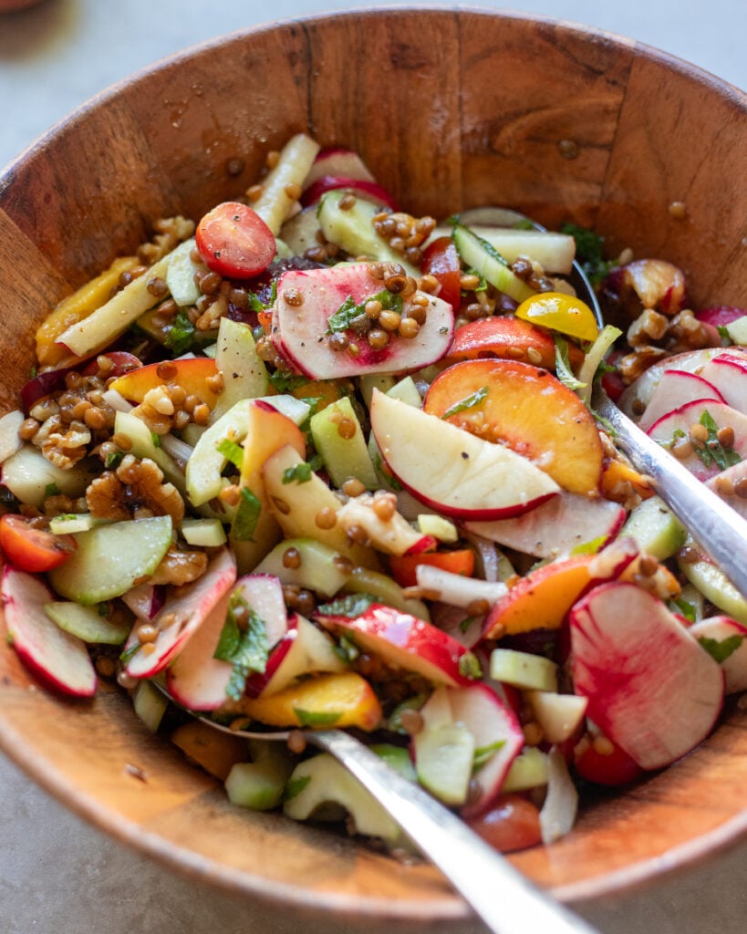 close up of summer peach sale with lentils, salad turnips, onions, nectarines and cucumbers