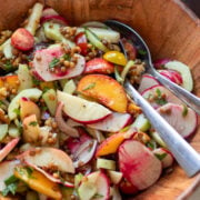 close up of summer peach sale with lentils, salad turnips, onions, nectarines and cucumbers