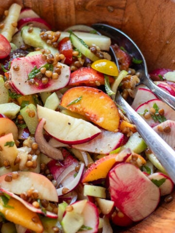 close up of summer peach sale with lentils, salad turnips, onions, nectarines and cucumbers